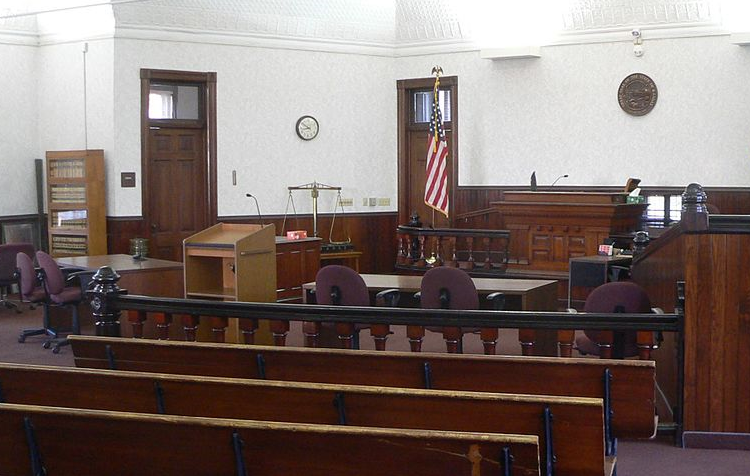 Creative Commons (CC-1.0) from Wikimedia Commons / Adapted from Ammodramus -- https://commons.wikimedia.org/wiki/File:Rush_County,_Kansas,_courthouse,_courtroom_2.JPG