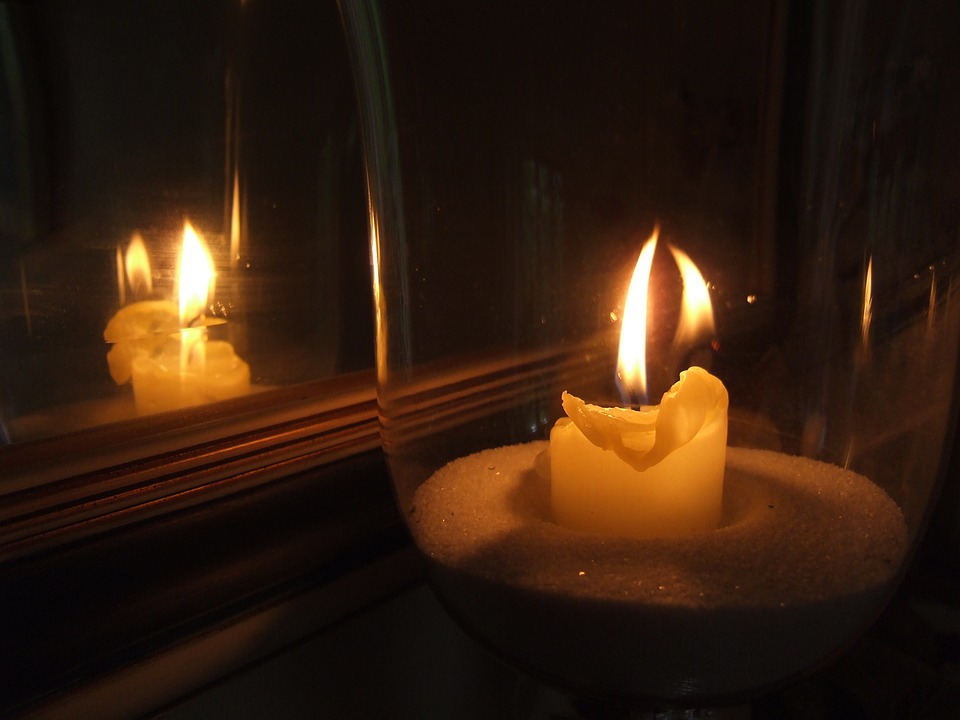 clairegelas via pixabay -- https://cdn.pixabay.com/photo/2015/11/19/20/52/candle-1051963_960_720.jpg